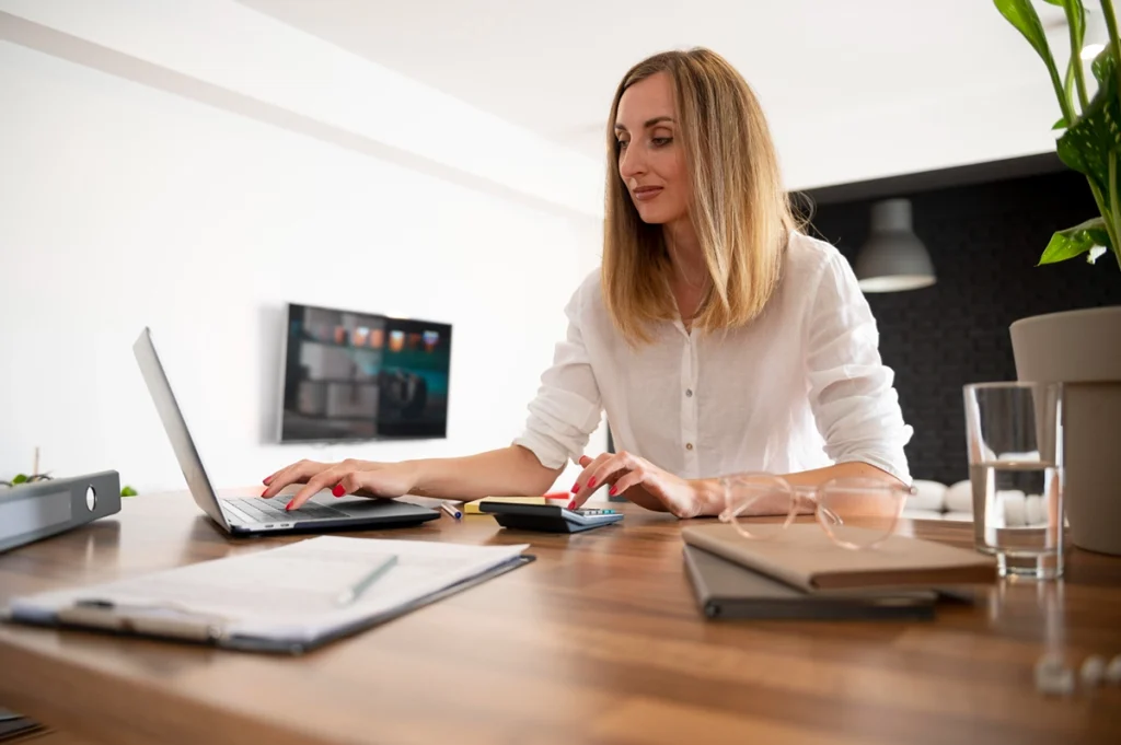 Host managing their time while reviewing Booking.com fee statements - Zeevou