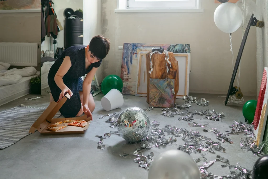 Guest cleaning a rental room to avoid a Booking.com damage deduction - Zeevou